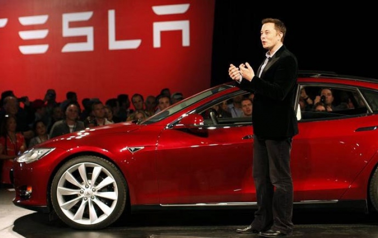 Tesla Reports Record Profit But Cuts Prices